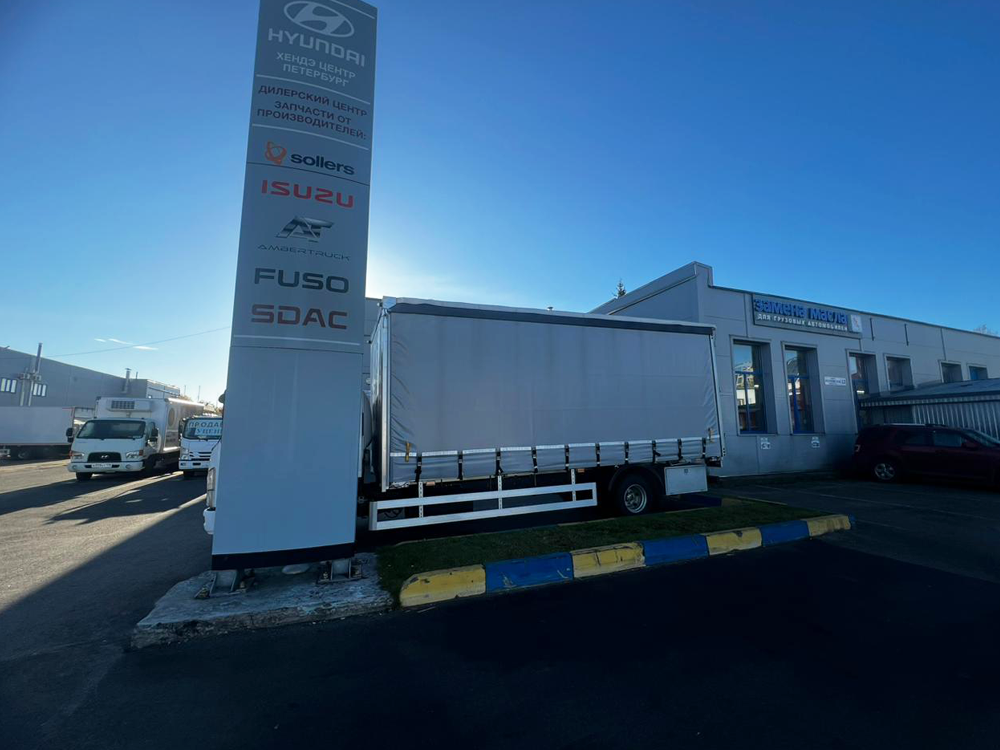 Бортовой грузовик ISUZU тентованный 5,5 т.,6,2 м фото 5