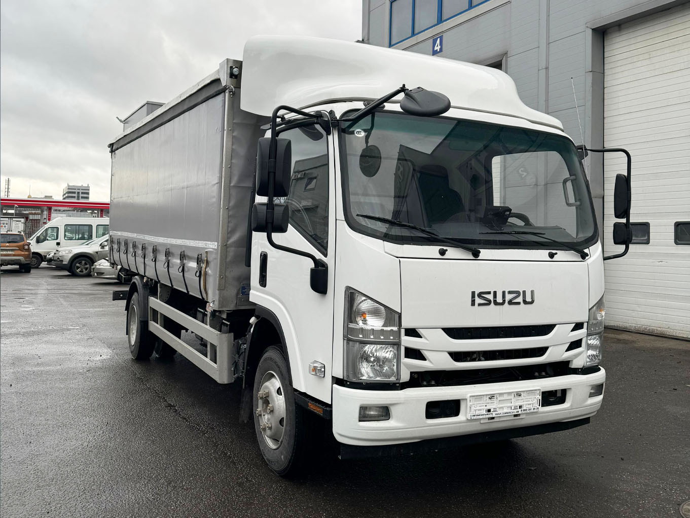 ISUZU грузовик бортовой еврошторный 10,5 т фото 2