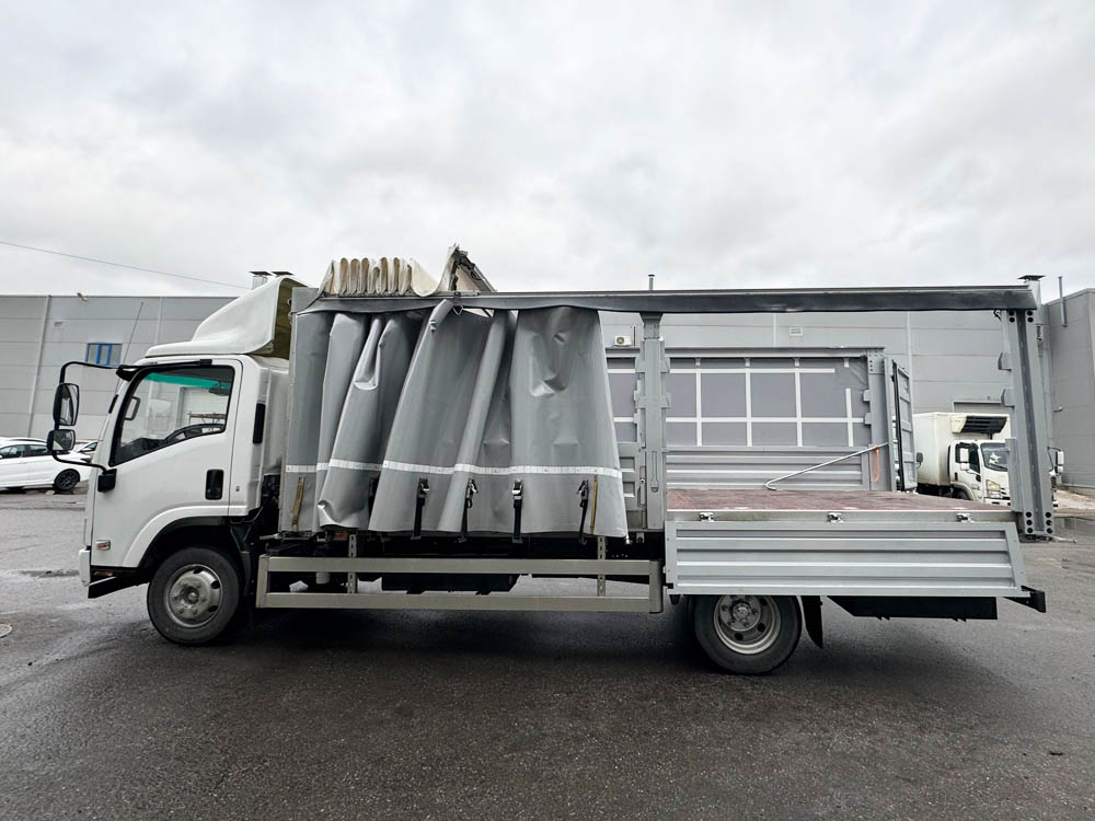 Isuzu тентованный 5,5 т., 5,6 м фото 6